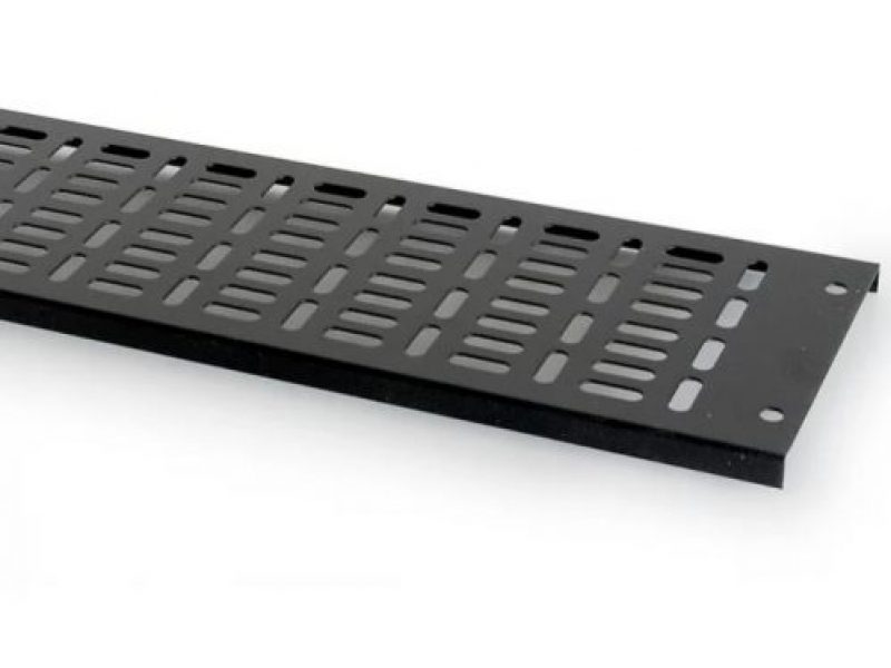 a black metal plate with holes