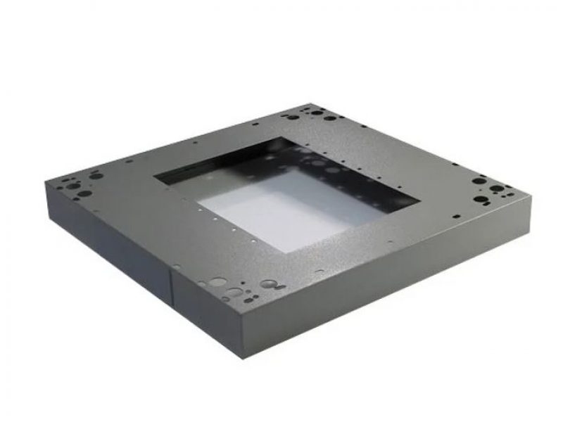 a grey square object with holes